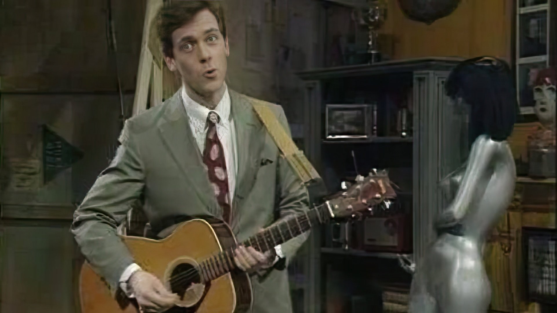 Hugh Laurie toca guitarra, piano e harmónica na perfeição