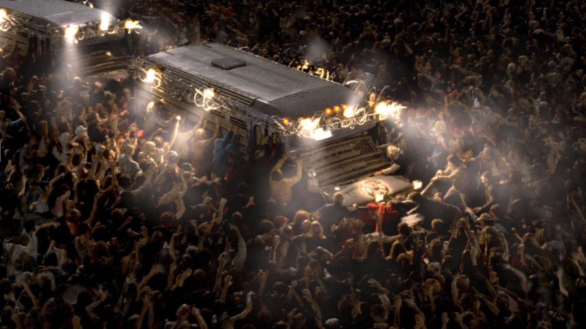 Hordas de zombies cercam um camião branco durante a noite