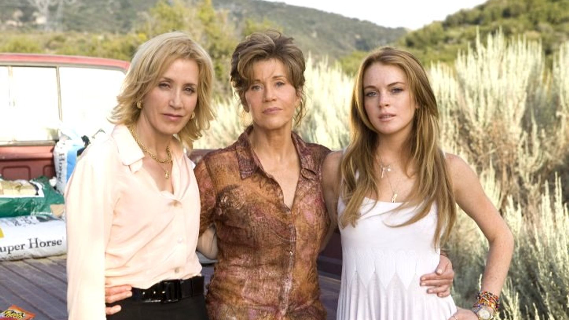 Felicity Huffman, Jane Fonda e Lindsay Lohan posam para a câmara na rua